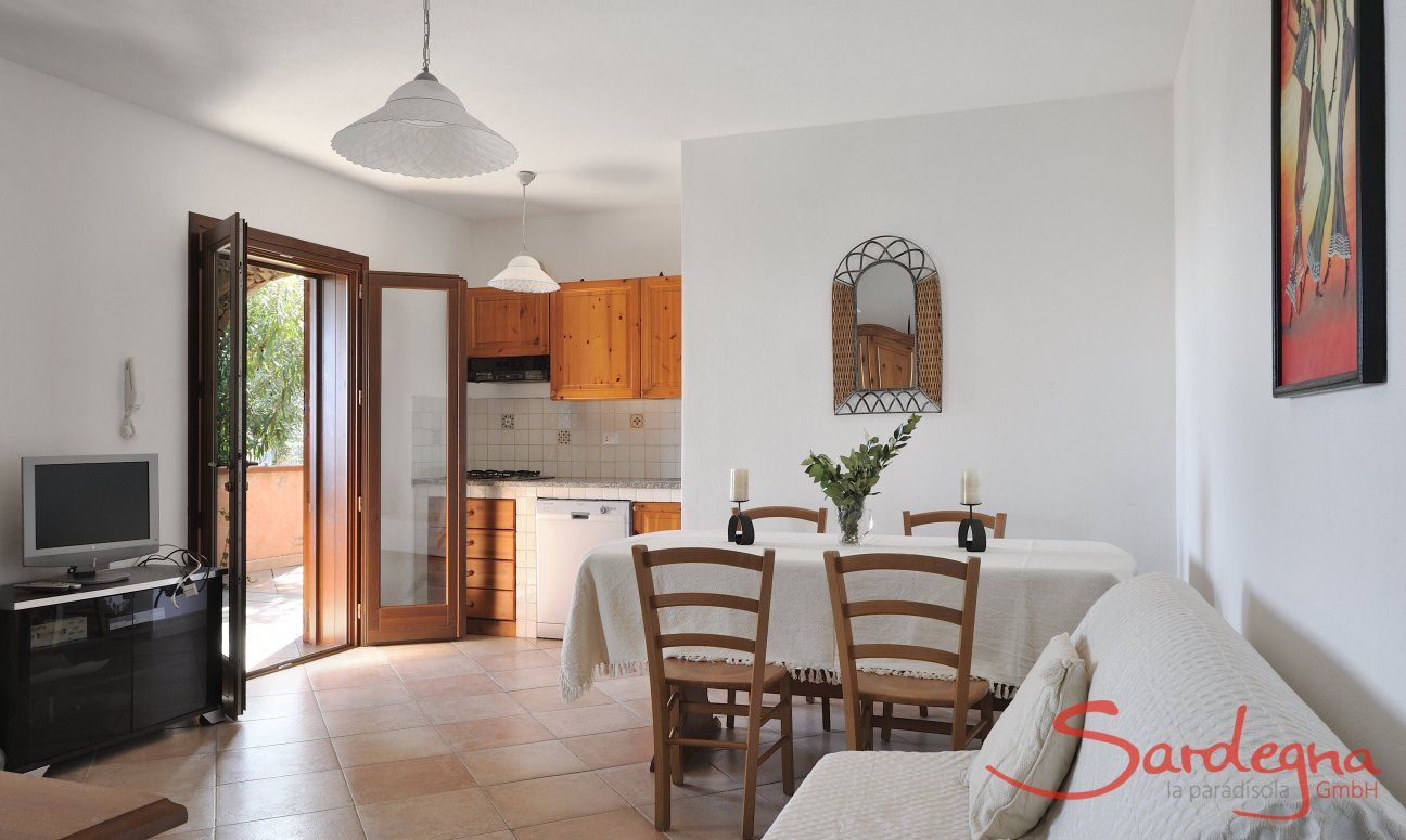 Apartment Castededdu 6 | Wohnbereich mit Küche, Esstisch und Sofaecke Wohnbereich mit Küche, Esstisch und Sofaecke