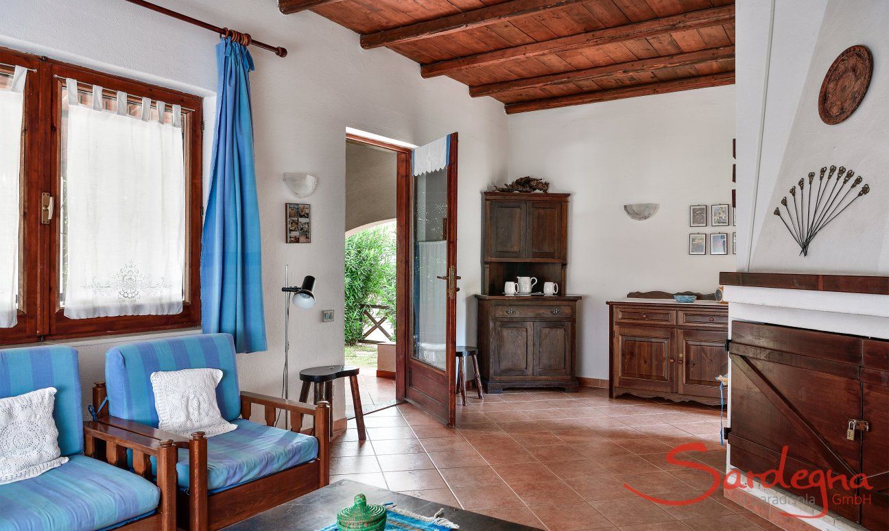 Villa Vela | Wohnbereich mit Sofaecke und Terrassenzugang Wohnbereich mit Sofaecke und Terrassenzugang