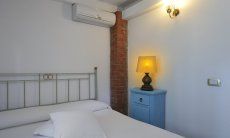 Villetta Pino | Schlafzimmer mit Ehebett und Klimaanlage Schlafzimmer