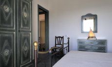 Apartment Castededdu 6 | Schlafzimmer 1 mit Doppelbett und Stauraum Schlafzimmer 1 mit Doppelbett und Stauraum