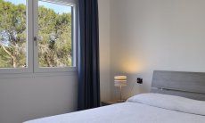 Apartment Cala Liberotto II | Schlafzimmer 1 mit Doppelbett Schlafzimmer 1 mit Doppelbett
