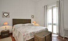 Li Conchi 33 | Schlafzimmer 1 mit Doppelbett und Fenstertür Schlafzimmer 1