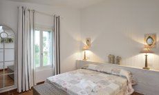 Li Conchi 16 | Schlafzimmer 1 mit Doppelbett und Fenster zum Garten Schlafzimmer 1