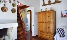 Villa Maria Lina | Kamin neben der Treppe zur Mansarde Kamin neben der Treppe zur Mansarde