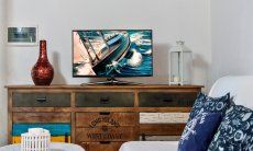 Villa Chiara | Sofaecke mit TV im Wohnbereich Sofaecke mit TV im Wohnbereich