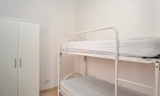 Villa Chiara | Schlafzimmer 3 mit Stockbett und Stauraum Schlafzimmer 3 mit Stockbett und Stauraum