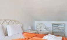 Villa Nodu Pianu Bianca | Schlafzimmer 1 mit Doppelbett im Obergeschoss Schlafzimmer 1 mit Doppelbett
