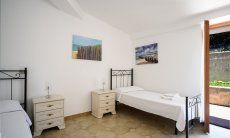 Villa Marco | Schlafzimmer 2 mit Gartenzugang Schlafzimmer 2 mit Gartenzugang