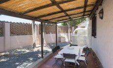 Casa Su Faru 5 | Überdachte Terrasse mit großem Esstisch Überdachte Terrasse mit großem Esstisch