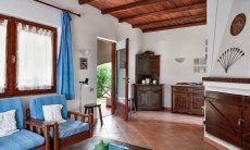 Villa Vela | Wohnbereich mit Sofaecke und Terrassenzugang Wohnbereich mit Sofaecke und Terrassenzugang