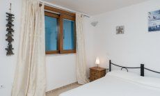 Villa del Campo | Schlafzimmer 4 im UG mit Doppelbett Villa del Campo, Is Molas, Pula